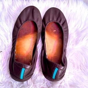 Tieks chocolate brown ballet flats.